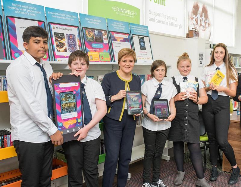 Nicola Sturgeon showcasing the Bookzilla app with students from Portobello High School